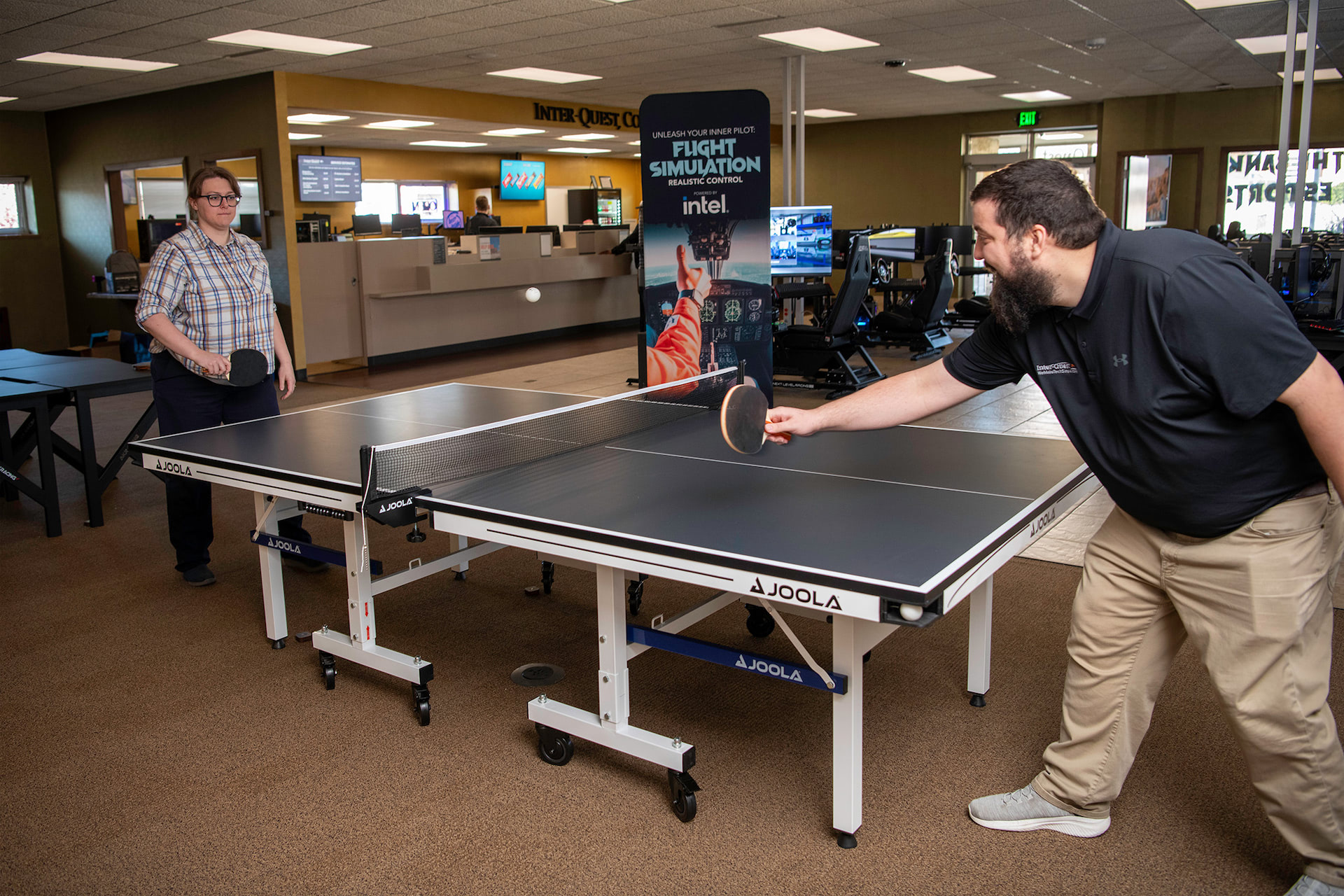 Two people playing table tennis